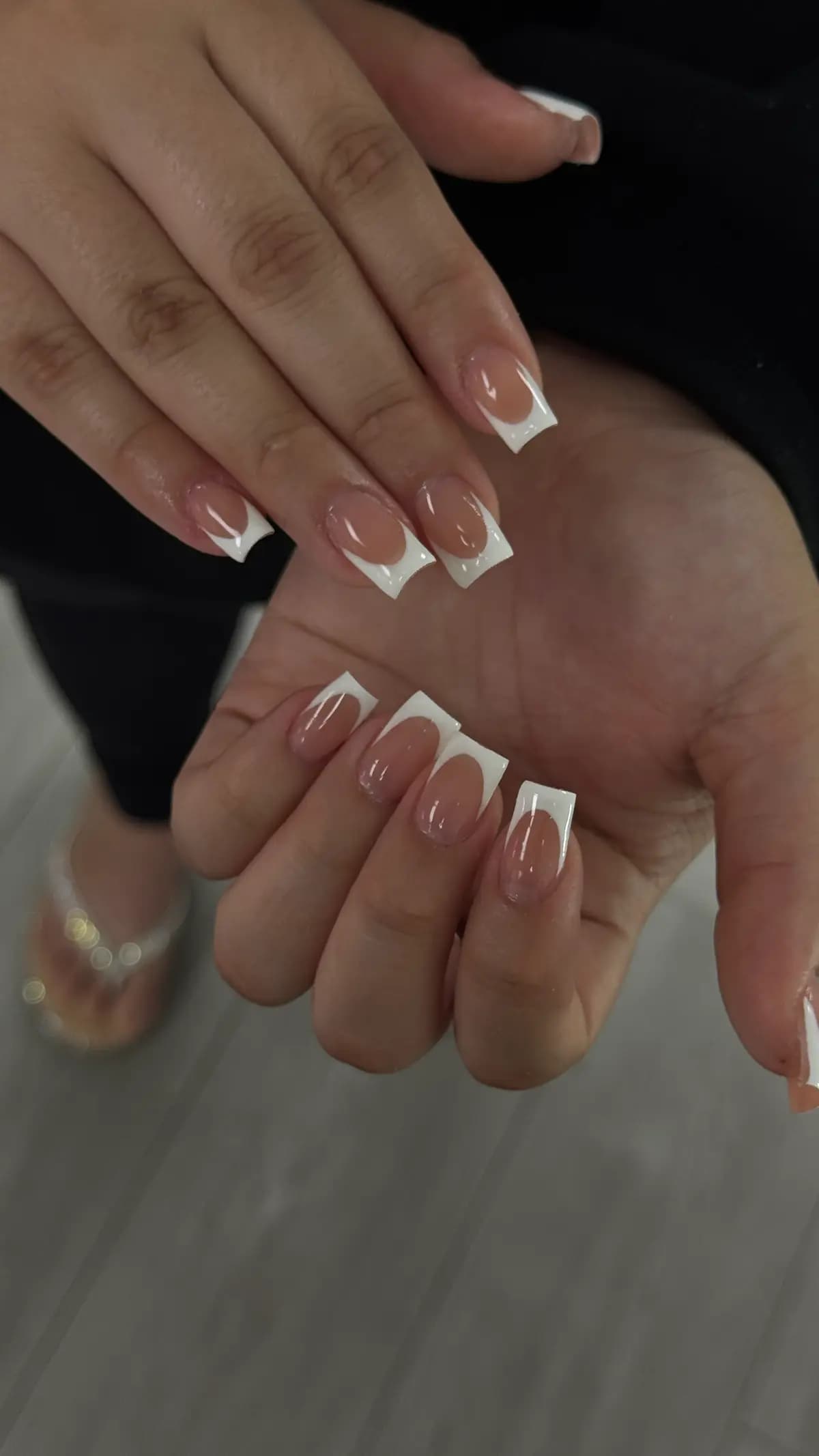 White french on extra-long square nails, both hands